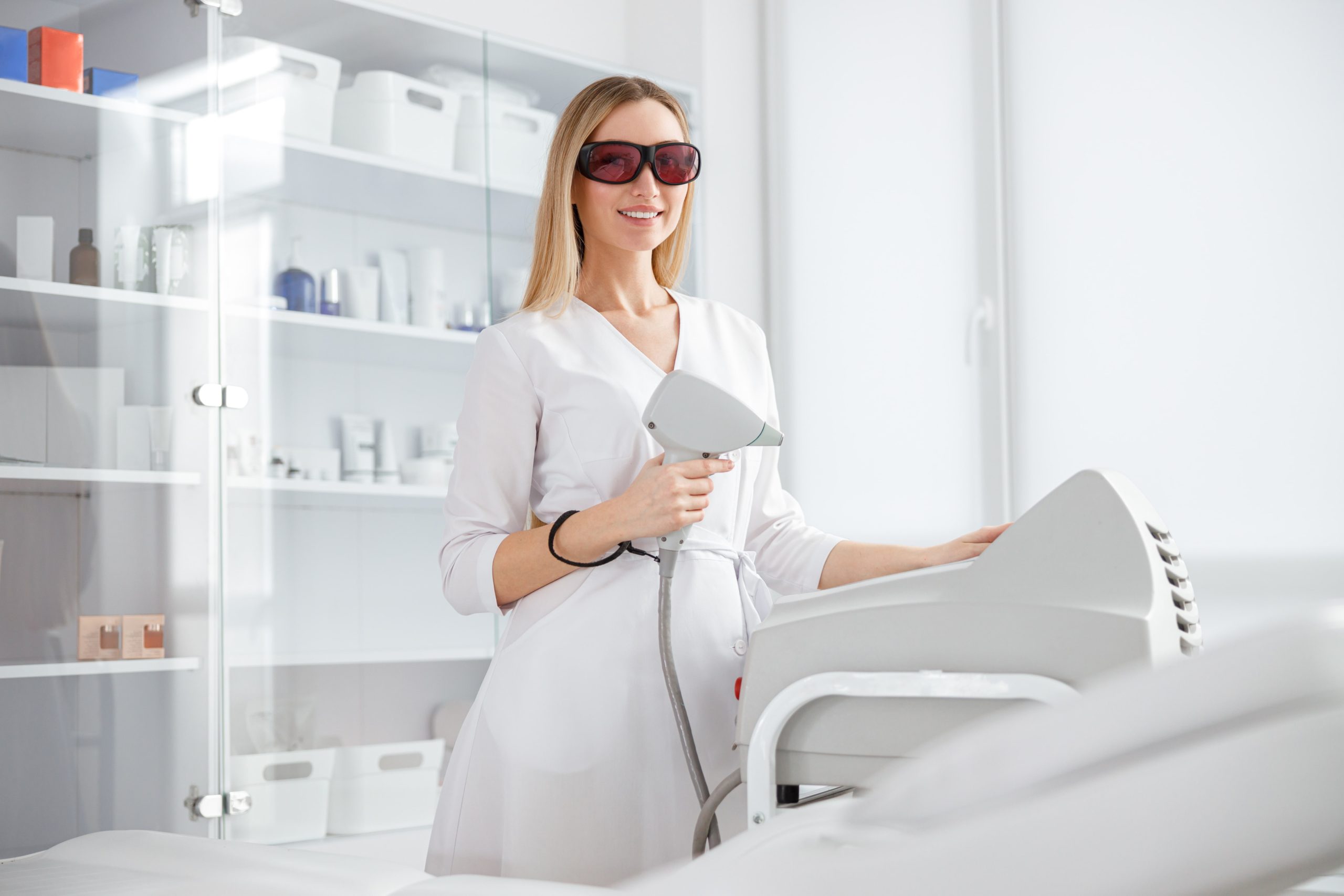 cheerful-woman-beautician-using-modern-equipment-i-2022-02-14-16-53-26-utc-min